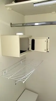 an empty closet with white cabinets and shelves at Miraflores Modern Baja Balta in Lima