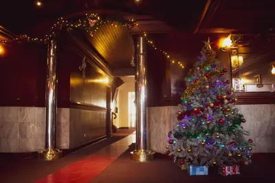a christmas tree in a room with lights at Hotel Internacional in Lima