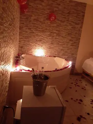 a bathroom with a bath tub with lights on it at Septima Maravilla in Lima