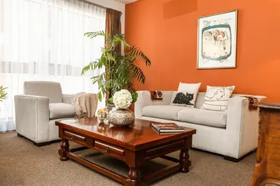 a living room with two couches and a coffee table at La Paz Apart Hotel in Lima
