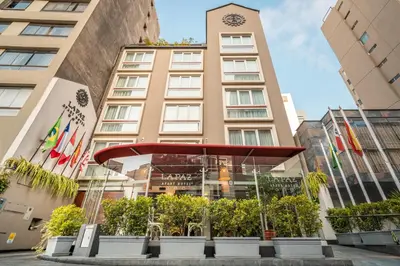 a building with a clock tower on top of it at La Paz Apart Hotel in Lima
