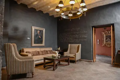 a living room with a couch and two chairs at Wyndham Costa del Sol Cusco in Cusco