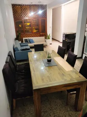 a living room with a table and a couch at Casita Libertad Chorrillos in Lima