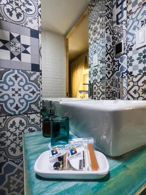 a bathroom with a sink and a plate on a counter at Casa Saphi in Cusco