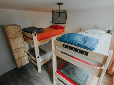 two bunk beds in a small room with at Alpes Lima Kennedy Hostel in Lima