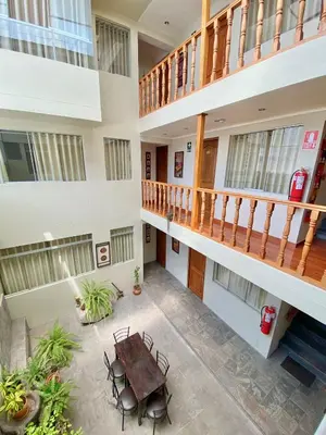 an overhead view of a building with a table and chairs at Hostal Casona Arrambide in Cusco