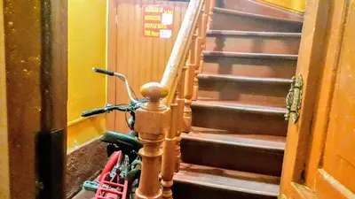 a bike parked next to a set of stairs at Habitaciones para Estudiantes Y/o Mochileros in Lima