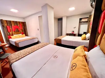 a hotel room with two beds in it at Montreal Magdalena Del Mar Hotel in Lima