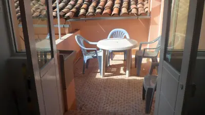a small table and chairs in a small room at Studio in historic center Cusco in Cusco