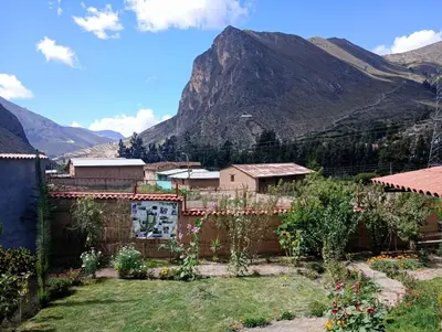 a village with a mountain in the background at La Finca Tarma in Tarma