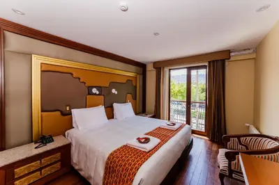 a hotel room with a large bed and a window at Yawar Inka Hotel in Cusco