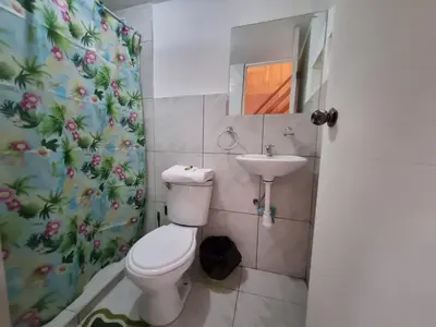 a bathroom with a toilet and a sink at La Casa de Laura - Plaza in Cusco