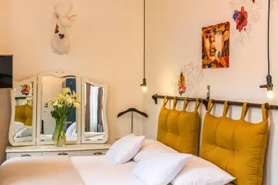 a bedroom with a bed and a mirror at X.O Art House in Cusco