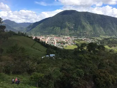 a group of people standing on top of a mountain at San Alberto Ecolodge in Oxapampa