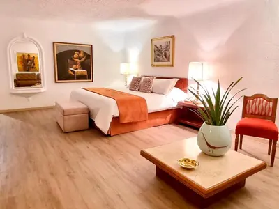 a hotel room with a bed and a table at Antara Hotel & Suites - Miraflores in Lima