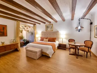 a large bedroom with a bed and a table at Antara Hotel & Suites - Miraflores in Lima