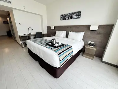 a hotel room with a large bed and a sink at Best Western Plus Urban Larco Hotel in Lima