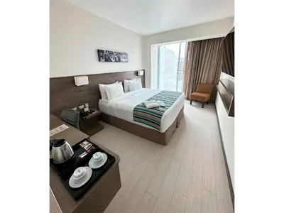 a hotel room with a bed and a large window at Best Western Plus Urban Larco Hotel in Lima