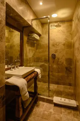 a bathroom with a sink and a shower at Sonesta Posadas del Inca - Valle Sagrado Yucay Urubamba in Urubamba