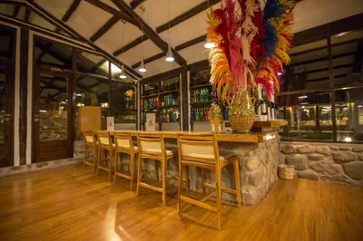 a bar with chairs and a counter in a restaurant at Tierra Viva Valle Sagrado Hotel in Urubamba