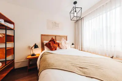 a bedroom with a bed and a window at qema Lima in Lima