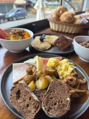 two plates of breakfast food on a table at qema Lima in Lima