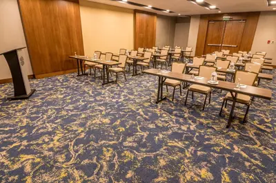 a conference room with tables and chairs in it at Sonesta Hotel El Olivar in Lima