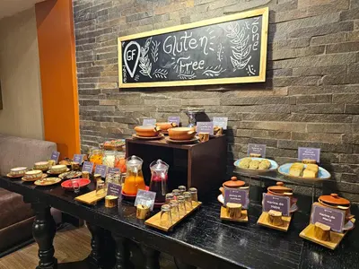 a table with different types of food on it at Sonesta Hotel Cusco in Cusco