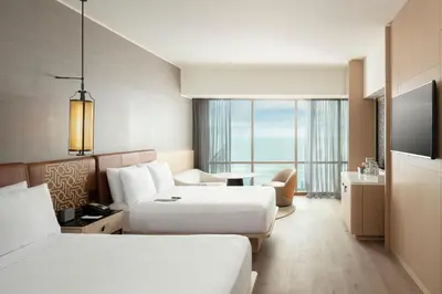 a hotel room with two beds and a large window at JW Marriott Hotel Lima in Lima