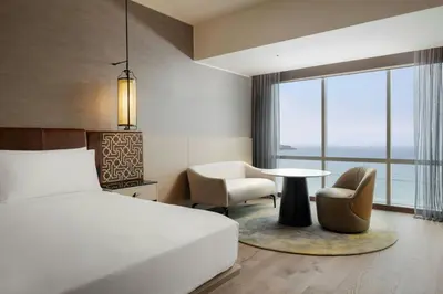 a hotel room with a bed and a table and chairs at JW Marriott Hotel Lima in Lima