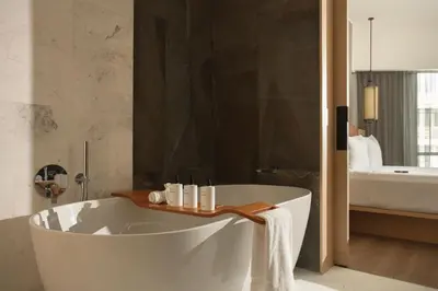 a bathroom with a white tub and a bath tub at JW Marriott Hotel Lima in Lima