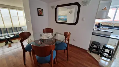 a dining room with a glass table and chairs at MALECÓN BALTA 758 - Miraflores in Lima