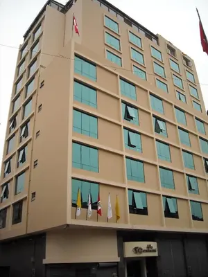 a building with flags on the side of it at Hotel Continental Lima in Lima