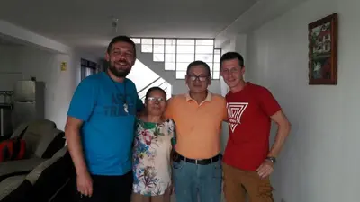 a group of three men and a woman posing for a picture at B&B La Casa del Turista in Lima