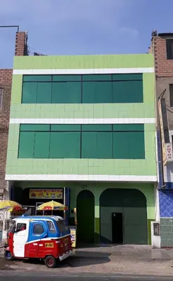 a van parked in front of a building at B&B La Casa del Turista in Lima