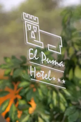 a sign that says el pumkin hotel at Hotel El Puma in Cusco
