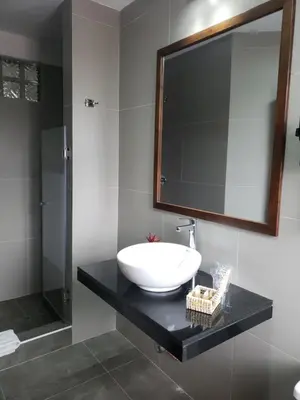 a bathroom with a sink and a mirror at Hotel Sueños del Inka in Cusco