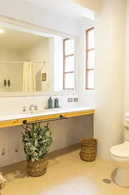 a bathroom with a sink and a toilet at Tariq Sacred Valley in Urubamba