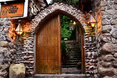 an entrance to a building with a wooden door at La Casa de Campo in Cusco