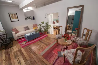 a living room with a couch and a table at Inkarri Cusco in Cusco