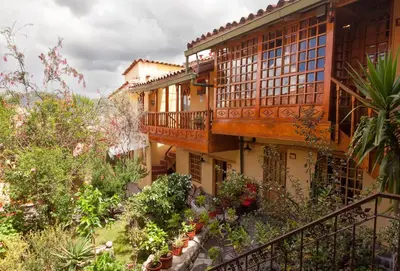 an external view of a building with plants and trees at Amaru Colonial in Cusco