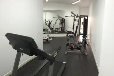 a gym with several tread machines in a room at Apartamento dúplex exclusivo y céntrico in Lima