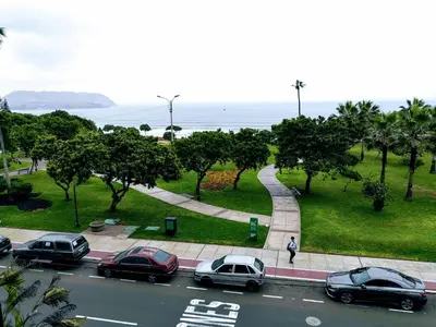 a group of cars parked on the side of a street at Miraflores Frente al Mar in Lima