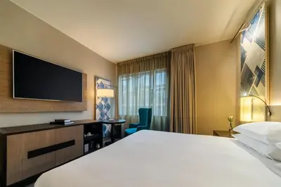 a hotel room with a bed and a television at Hyatt Centric San Isidro Lima in Lima
