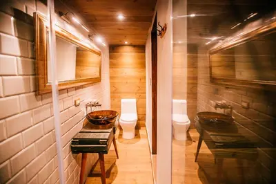 a bathroom with two toilets and a sink at Casa Azul in Lima