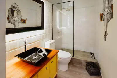 a bathroom with a sink and a toilet and a shower at Casa Azul in Lima
