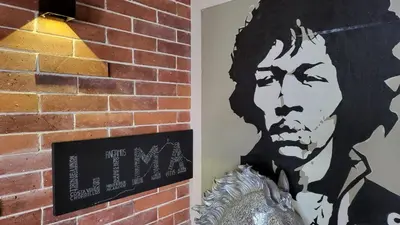 a black and white picture of a man on a brick wall at Casa Azul in Lima