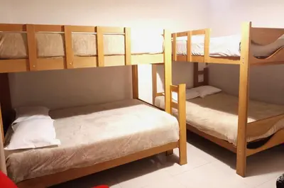 two bunk beds in a small room with at In the heart of Lima in Lima