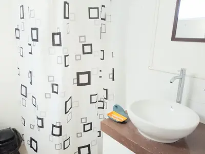 a bathroom with a toilet and a sink at In the heart of Lima in Lima