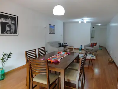 a dining room with a table and chairs at Miraflores Bello Apartamento in Lima